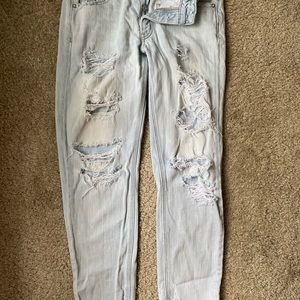 distressed light wash tom girl jeans